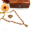 Gold tone designer with devi pendant J440