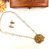 Gold tone long chain with devi pendant J056
